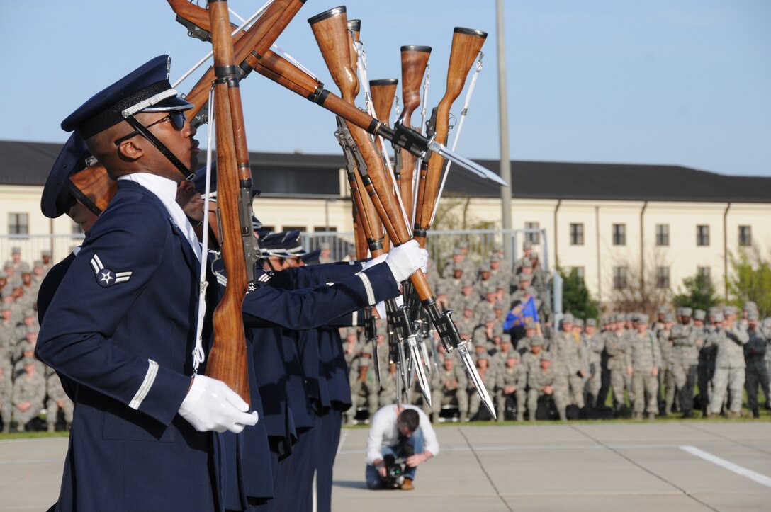 The U.S. Air Force Honor Guard Drill Team creates a domino effect with their M-1 rifles during their new 16-man drill performance routine March 6 on Keesler Air Force Base, Miss. Drill Team members attended a month long training camp to revamp drills, giving them a new edge for 2012 performances. Maj. Gen. Darren McDew, Air Force District of Washington commander, approved and praised the new routine during a March 15 performance at Joint Base Andrews, Md. (U.S. Air Force photo by Kemberly Groue)