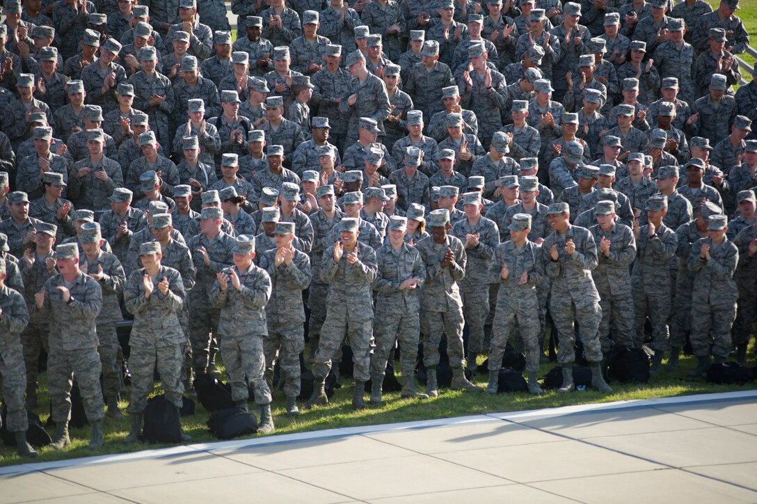 Service member’s applaud the U.S. Air Force Honor Guard Drill Team performance March 6 on Keesler Air Force Base, Miss. Drill Team members attended a month long training camp in which they revamped drills, giving them a new edge for upcoming 2012 performances. Airmen from Keesler were among the first to witness the newly choreographed routine. (U.S. Air Force courtesy photo)