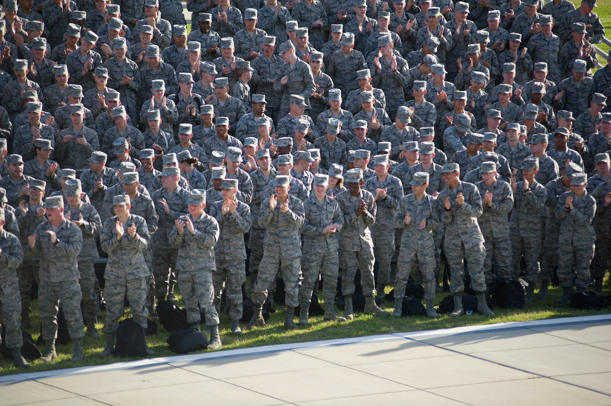 Service member’s applaud the U.S. Air Force Honor Guard Drill Team performance March 6 on Keesler Air Force Base, Miss. Drill Team members attended a month long training camp in which they revamped drills, giving them a new edge for upcoming 2012 performances. Airmen from Keesler were among the first to witness the newly choreographed routine. (U.S. Air Force courtesy photo)