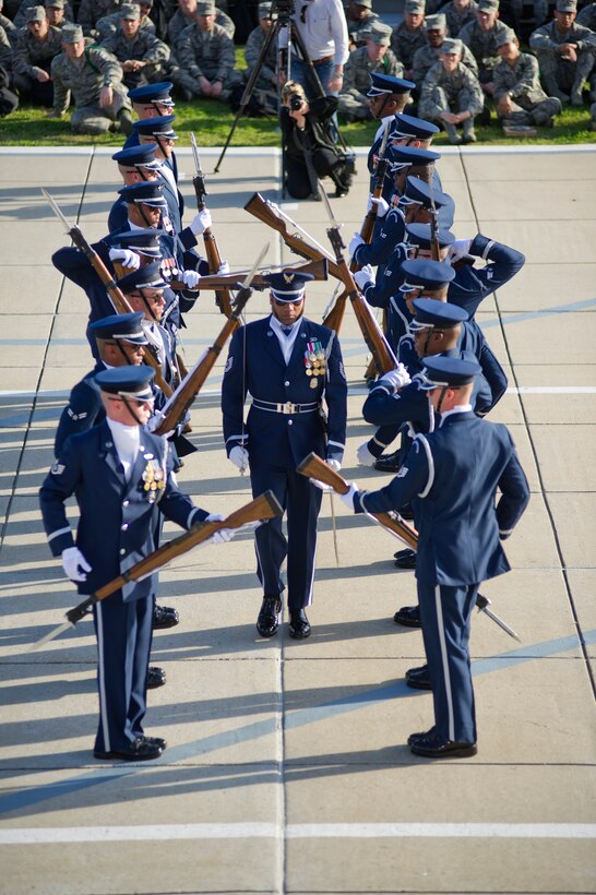 The U.S. Air Force Honor Guard Drill Team executes the newly unveiled 16-man drill performance March 6 on Keesler Air Force Base, Miss. Drill Team members attended a month long training camp in which they revamped drills, giving them a new edge for upcoming 2012 performances. Airmen from Keesler were among the first to witness the newly choreographed routine. (U.S. Air Force courtesy photo) 
