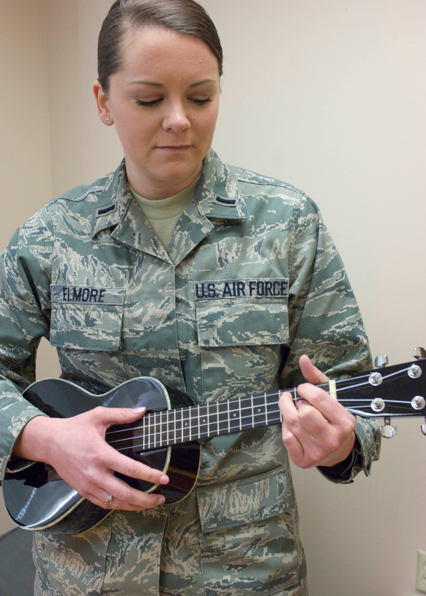 First Lt. Ashley Elmore, 28th Force Support Squadron manpower and personnel flight commander, strums her ukelele at Ellsworth Air Force Base, S.D., March 2, 2012.  Elmore was selected to be part of the 2012 Tops in Blue performance group.  (Airman 1st Class Anania Tekurio/Released)   