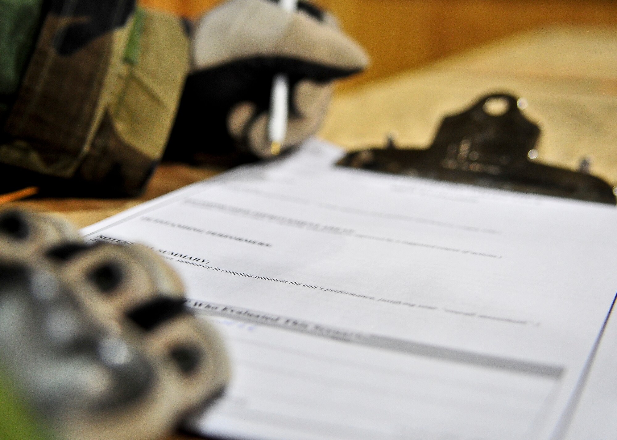 A member of the 51st Security Forces Squadron exercise evaluation team looks over a chart before writing down critques on the procedures taken by Airmen March 19, 2012, during exercise Beverly-Midnight 12-01. Exercises such as this test Osan's ability to survive and operate during war while also testing the ability to plan and excute and exercise. (U.S. Air Force photo/Senior Airman Adam Grant)