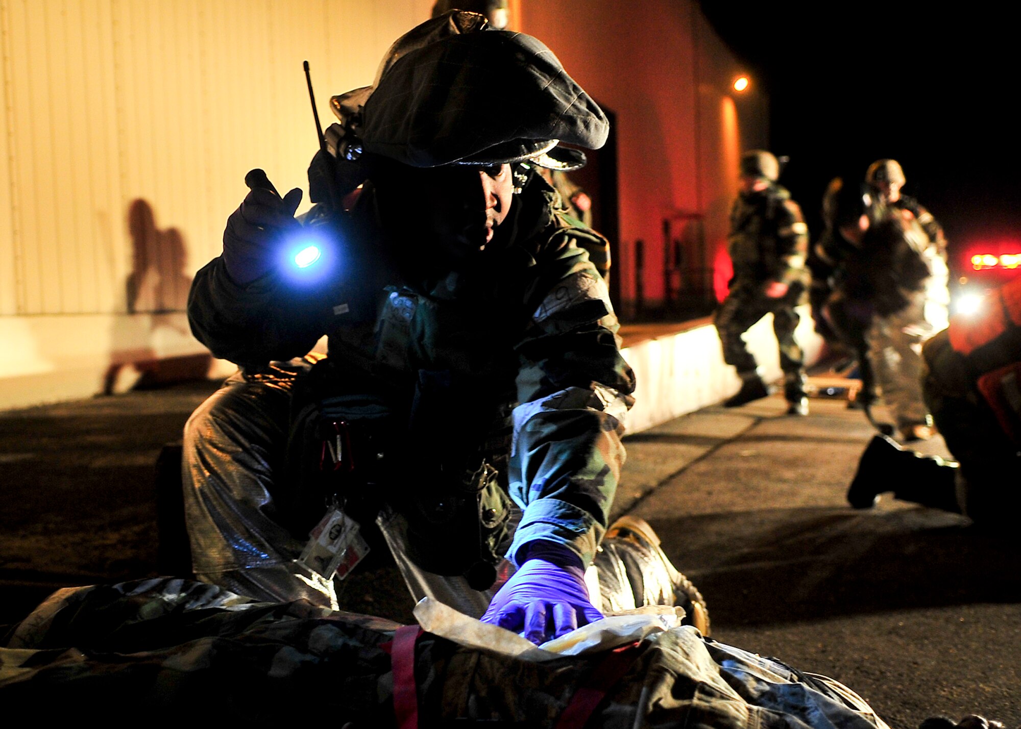 Staff Sgt. Norman Henderson, 51st Civil Engineer Squadron firefighter, assesses a casualty March 19, 2012, during exercise Beverly-Midnight 12-01. Exercises such as this test Osan's ability to survive and operate during war while also testing the ability to plan and excute and exercise. (U.S. Air Force photo/Senior Airman Adam Grant)