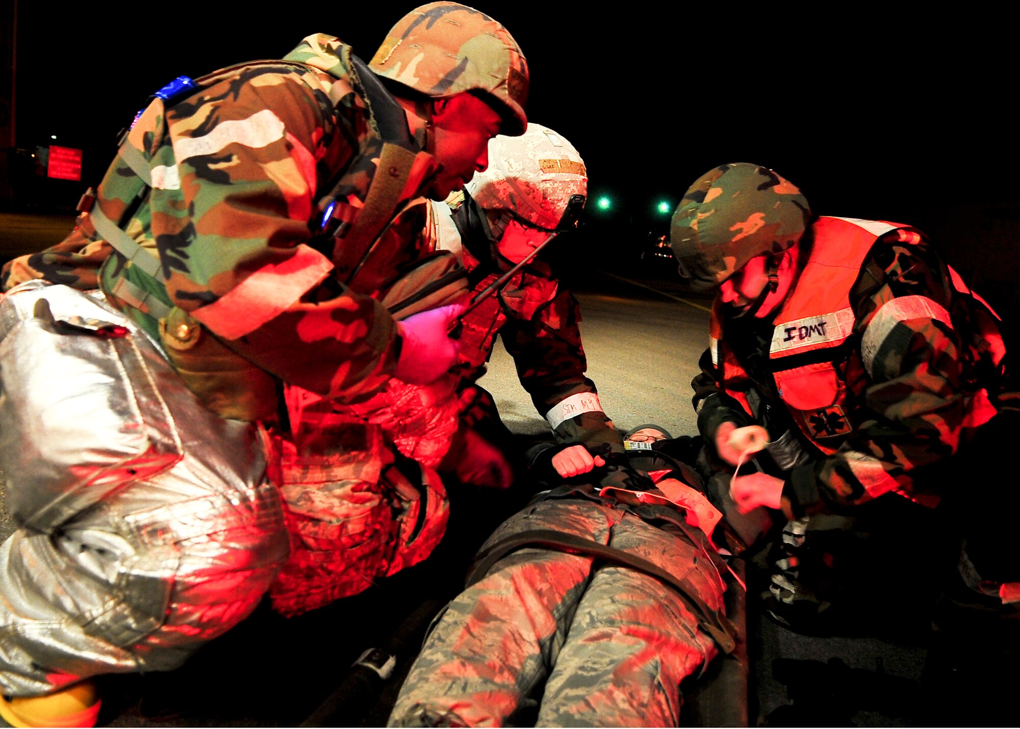 Members of the 51st Civil Engineer Squadron assist a casualty during an active shooter scenario March 19, 2012, during exercise Beverly-Midnight 12-01. Exercises such as this test Osan's ability to survive and operate during war while also testing the ability to plan and excute and exercise. (U.S. Air Force photo/Senior Airman Adam Grant)