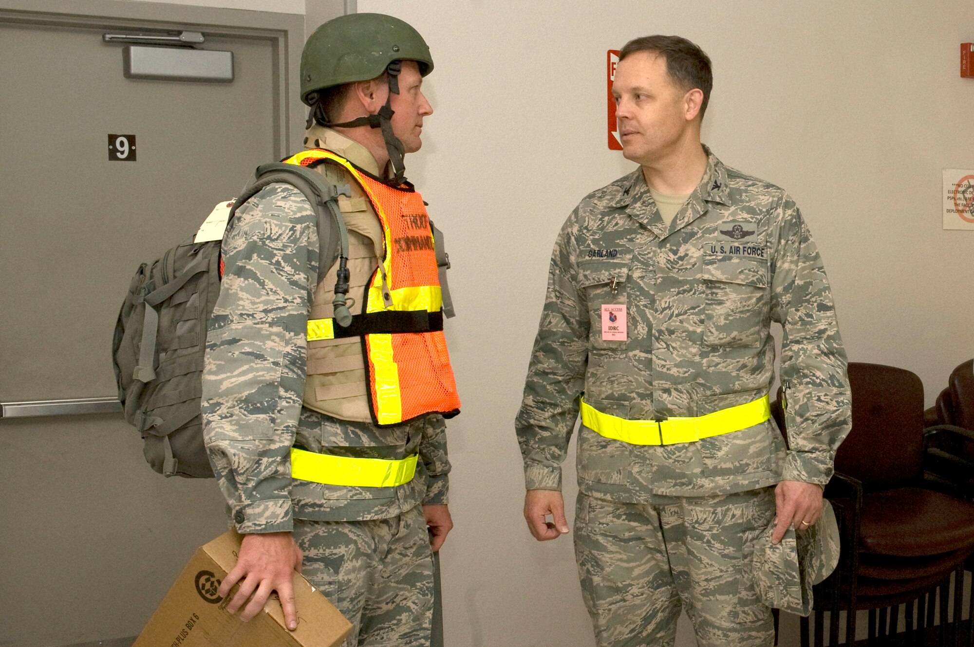 Right to left  U.S. Air Force Brig. Gen. (sel) Steven Garland,  99th Air Base Wing commander and Maj. Walter Heathcoat, 99th Force Support Squadron Manpower and Personnel Flight commander, discuss the wing's preparation during an operational readiness exercise March 19, 2012, at Nellis Air Force Base, Nev. The exercise test the wing's capability to deploy combat power for our nation, wherever and whenever needed
worldwide. (U.S. Air Force photo by Airman 1st Class Daniel Hughes)
