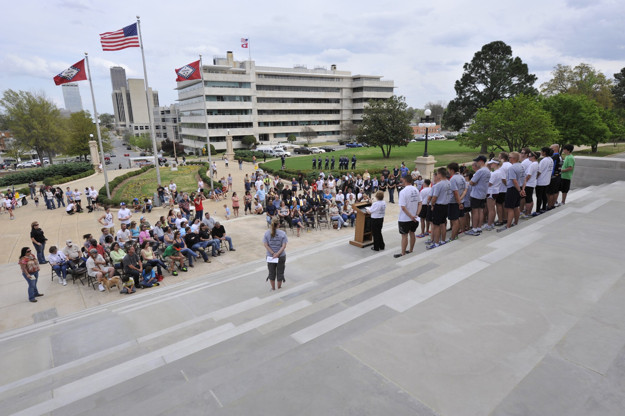 Arkansas community members gather together outside the state capitol during the Arkansas Run for the Fallen March 18, 2012, in Little Rock, Ark. Runners who participated placed a flag down at each mile to remember a fallen service member. (U.S. Air Force photo by Airman 1st Class Rusty Frank)