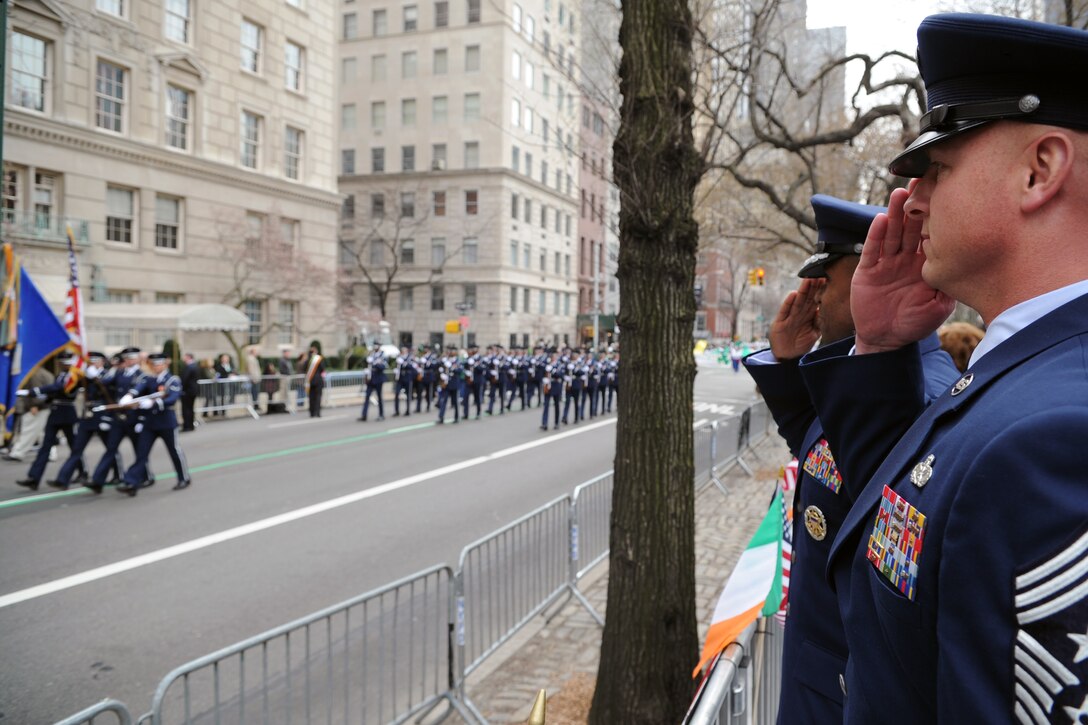 Air Force District of Washington Commander, Maj. Gen. Darren W. McDew, and Chief Master Sgt. Scott A. Fuller, AFDW Command Chief Master Sergeant, salute the U.S. Flag carried by the U.S. Air Force Honor Guard during the 250th annual St. Patrick’s Day Parade in New York City, N.Y., on March 17.  This year marks the 250th St. Patrick’s Day Parade, which began in 1762. (U.S. Air Force photo/Tech. Sgt. Raymond Mills) 
