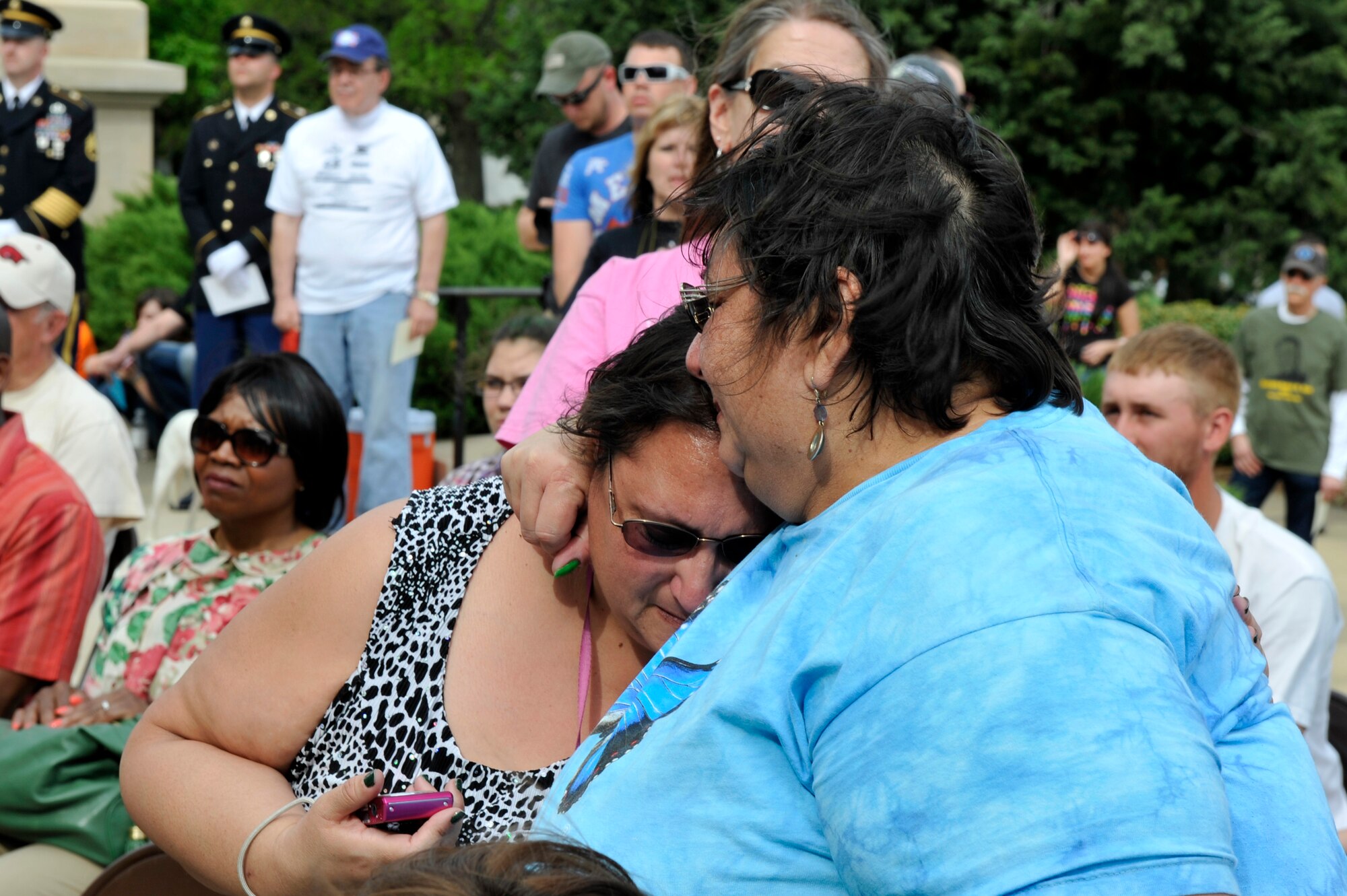 Arkansas community members grieve during the Arkansas Run for the Fallen March 18, 2012, outside the state capitol in Little Rock, Ark. During the event, a list of over 100 names of Arkansas’ fallen military service members was read. (U.S. Air Force photo by Airman 1st Class Rusty Frank)