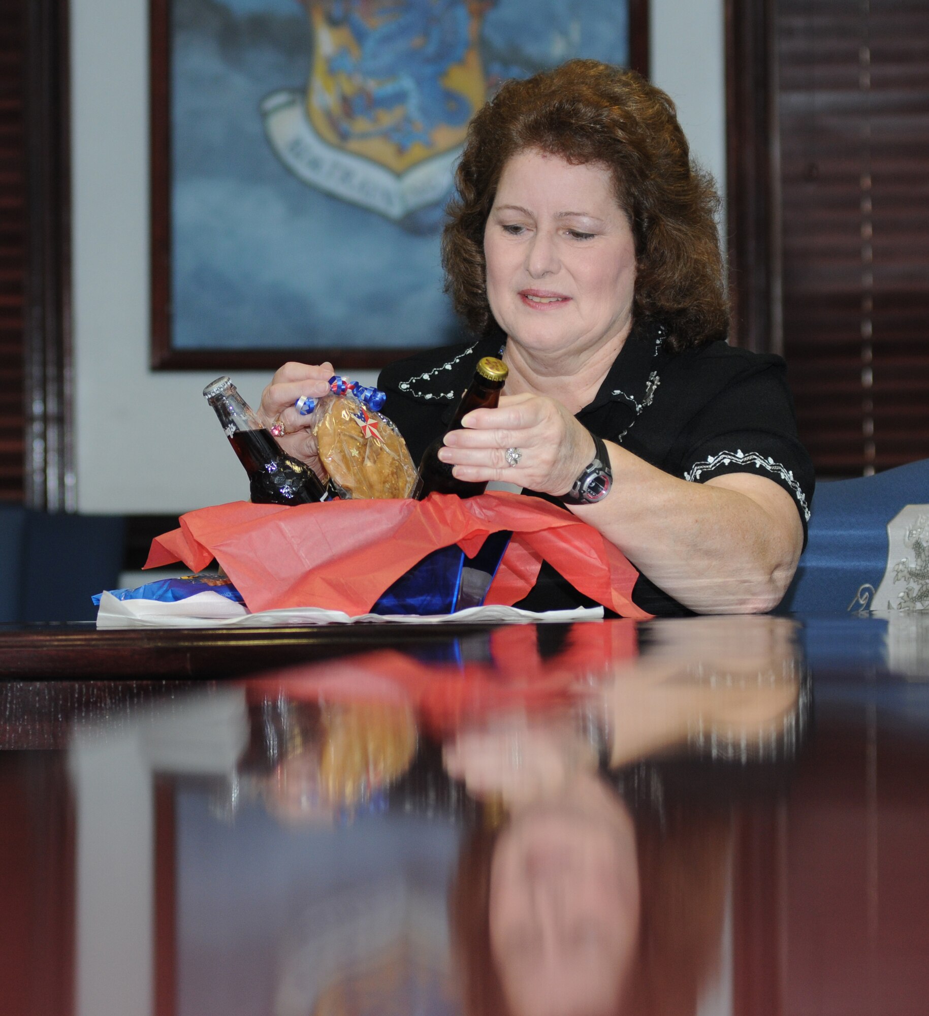 Michele Rivera, 81st Training Wing protocol specialist, prepares a welcome basket for a visiting general officer in the 81st TRW conference room March 16, 2012, Keesler Air Force Base, Miss.  The wing’s protocol office is responsible for behind-the-scene actions that occur during distinguished visits such as coordinating their itinerary, setting up lodging and arranging transportation to make the visit run as smoothly as possible.  (U.S. Air Force photo by Kemberly Groue)
