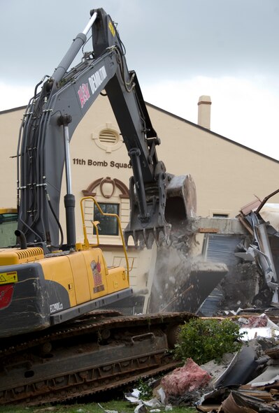 An excavator demolishes a building on Barksdale Air Force Base, La., March 20. The building, no longer of use, was demolished to make room for a future project. (U.S. Air Force photo/Airman 1st Class Benjamin Gonsier)(RELEASED)