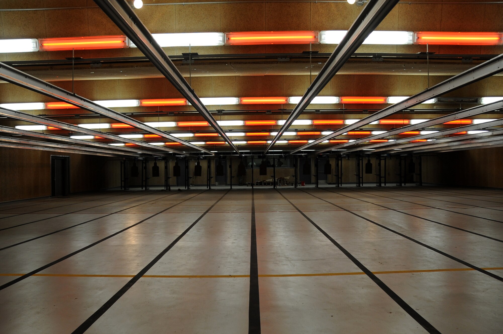 The Keesler Indoor Firing Range, located behind the  81st Security Forces Squadron, Keesler Air Force Base, Miss., is approximately 90 percent complete. The 81st SFS and other base personnel will use the facility for weapons training and qualifications. A retrieval system inside the firing range can be controlled by the range tower operator to set conditions such as illuminating targets for night time conditions or using strobe lights to give the effect of police cars at night.  (U.S. Air Force photo by Kemberly Groue)