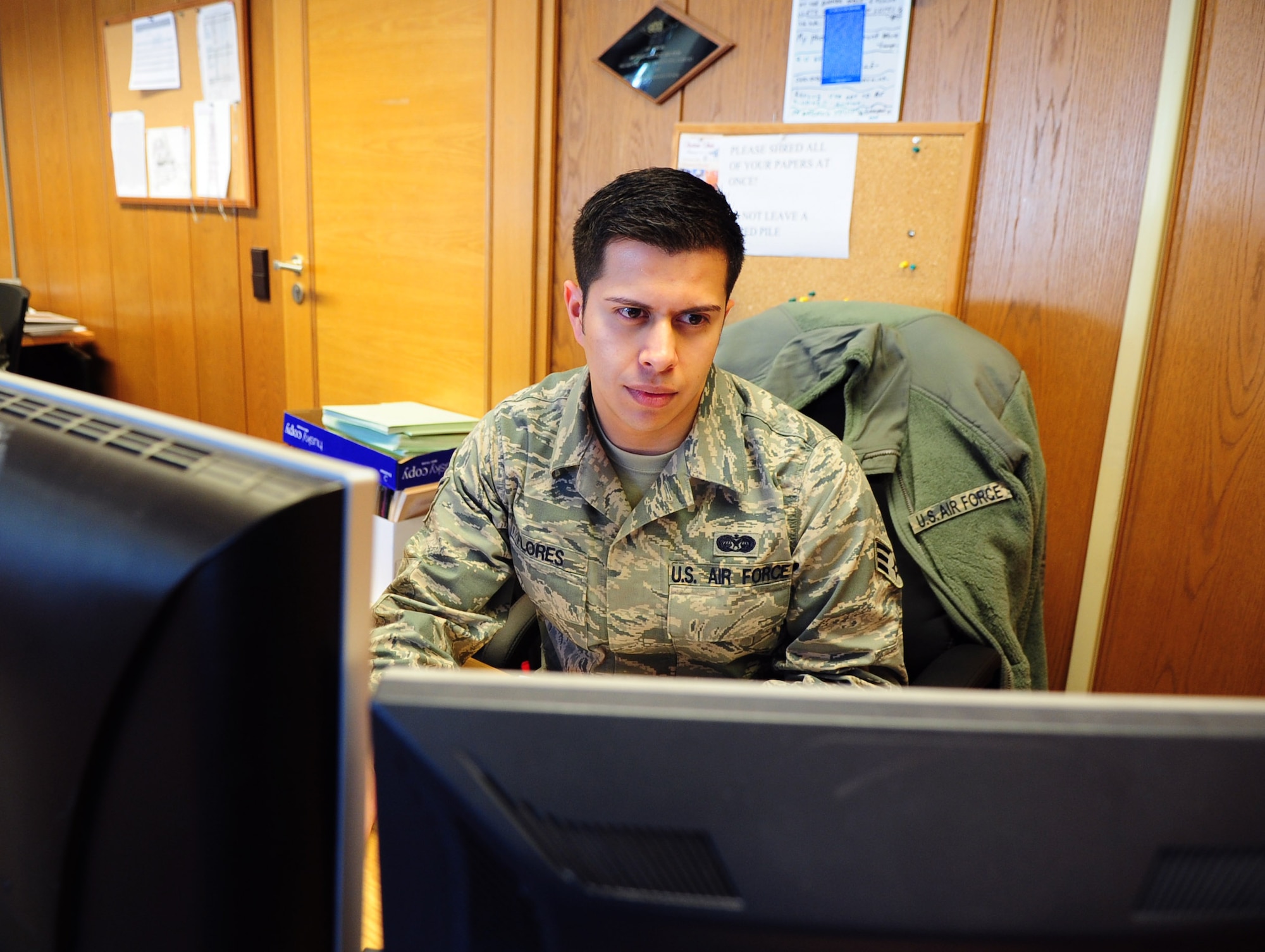 Senior Airman Jared Flores, 86th Airlift Wing paralegal, completes his portion of the legal process, Law Center, Ramstein Air Base, Germany, March 20, 2012. Members at the Law Center strive to provide on-time, on-target legal advice and services to the Kaiserslautern Military Community. (U.S. Air Force photo by Senior Airman Brittany Perry)