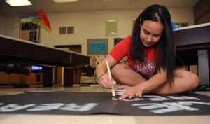 Karla Rogers, Idaho Youth of the Year for 2011, creates a poster in participation of Kick Butts Day, an annual celebration in the fight against teen tobacco use, March 5, 2012, at Mountain Home Air Force Base, Idaho. Rogers will be representing the state of Idaho in the Pacific Region Youth of the Year competition. (U.S. Air Force photo by Airman 1st Class Jonathan Glanville/Released)