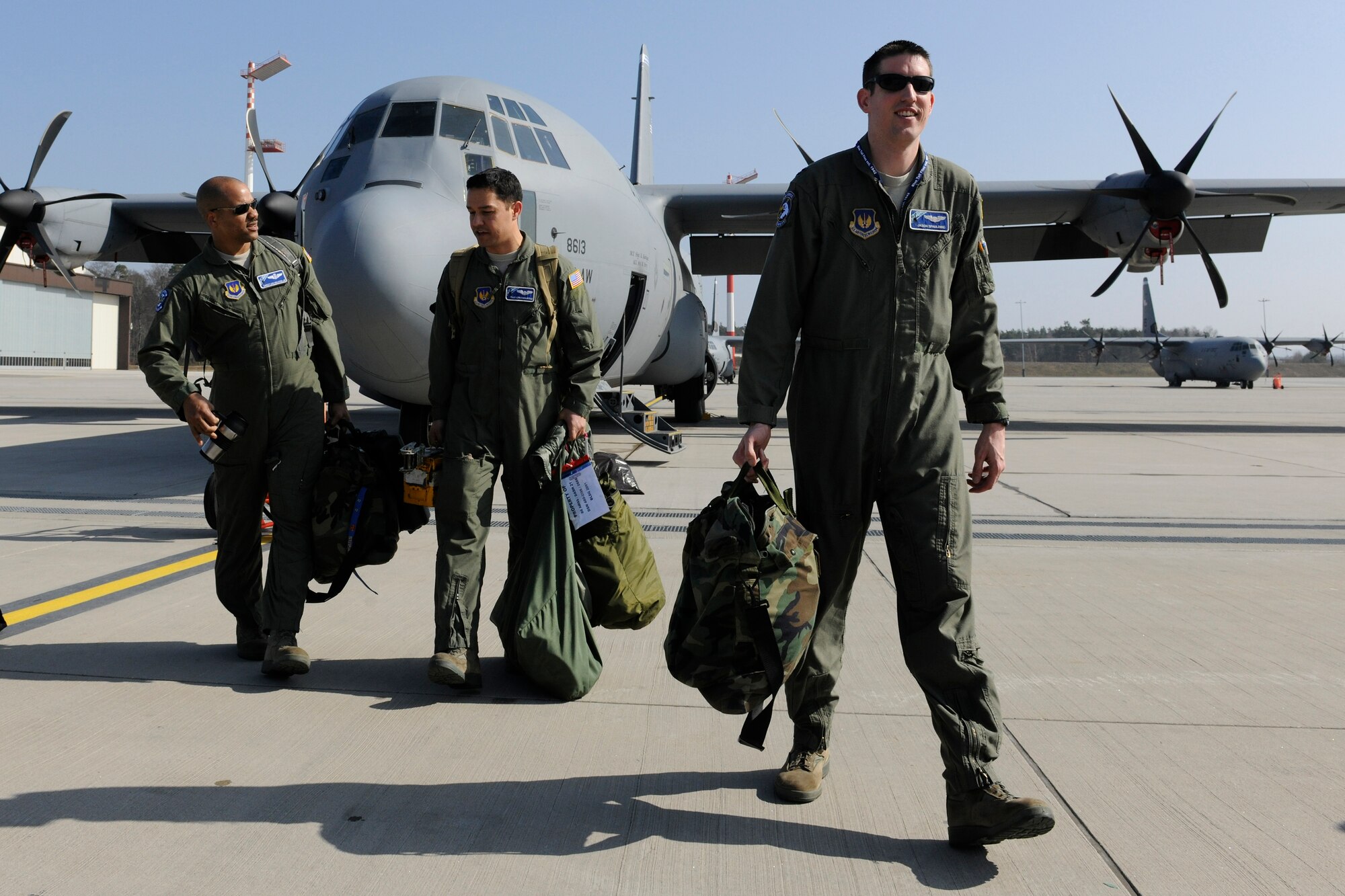 Capt. Jason Spaulding, 37th Airlift Squadron pilot, Chief Master Sgt. Lewis Holston, 37th Airlift Squadron superintendent, and Tech. Sgt. Kepa Kahihikolo, 37th Airlift Squadron loadmaster, depart from a C-130J after completing a week-long training exercise with a ten-bundle container deployment system drop March 16, 2012 at Ramstein Air Base, Germany.  The cargo was dropped in order to support field-training exercises for the 173rd Airborne Brigade Combat Team from Vicenza, Italy. This training gave pilots and loadmasters here an opportunity to practice this type of airdrop.  (U.S. Air Force photo/Staff Sgt. Chris Willis)