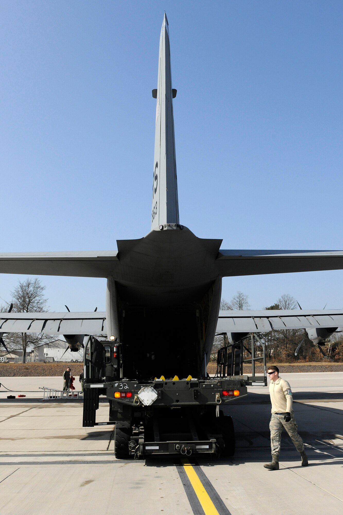 Members of the 86th Maintenance Group unload a C-130J after a ten-bundle container deployment system drop mission, March 16, 2012 at Ramstein Air Base, Germany.  The cargo was dropped in order to support field-training exercises for the 173rd Airborne Brigade Combat Team from Vicenza, Italy. This training gave pilots and loadmasters here an opportunity to practice this type of airdrop.  (U.S. Air Force photo/Staff Sgt. Chris Willis)