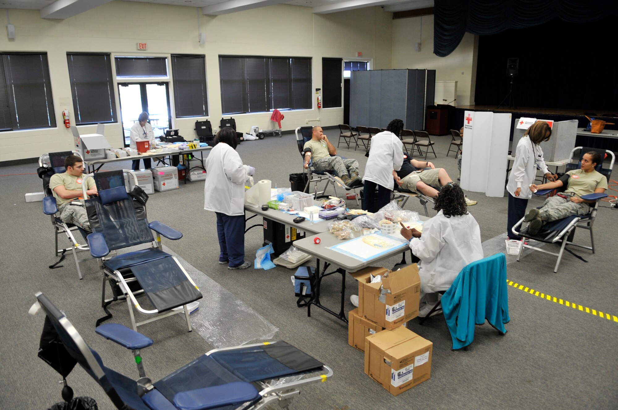 American Red Cross nurses take blood from U.S. Air Force Airmen at the Community Center at Shaw Air Force Base, S.C., Mar. 14, 2012.  The 20th Fighter Wing hold a blood drive four times annually. (U.S. Air Force photo by Airman Nicole Sikorski/Released) 
