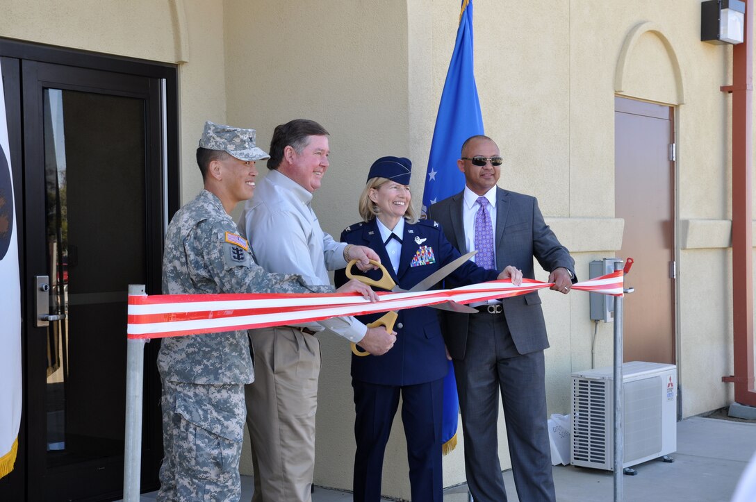 Col. Mark Toy, Rep. Ken Calvert, Col. Mary Aldrian, and Hector Sanchez, owner of P&S Construction Inc., cut the cermonial ribbon at the entrance of the new indoor range facility at March Air Reserve Base March 10.