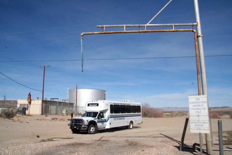 A Barstow city bus loaded with contractors drive past one of the existing water points at Fort Irwin. The U.S. Army Corps of Engineers and the Barstow Chamber of Commerce held an Industry Day at the Barstow Community College in efforts to attract potential local contractors for a $100 million water plant for Fort Irwin and National Training Center Feb. 22. After the morning briefings, transportation to Fort Irwin was provided by the City of Barstow Chamber of Commerce.