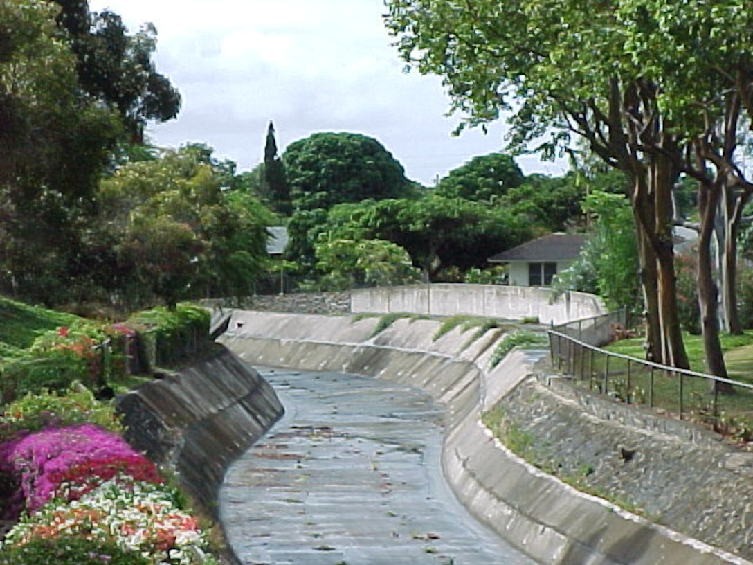 Photograph looking downstream at the completed Kuliouou Stream flood control project. The project was completed in 1970. 