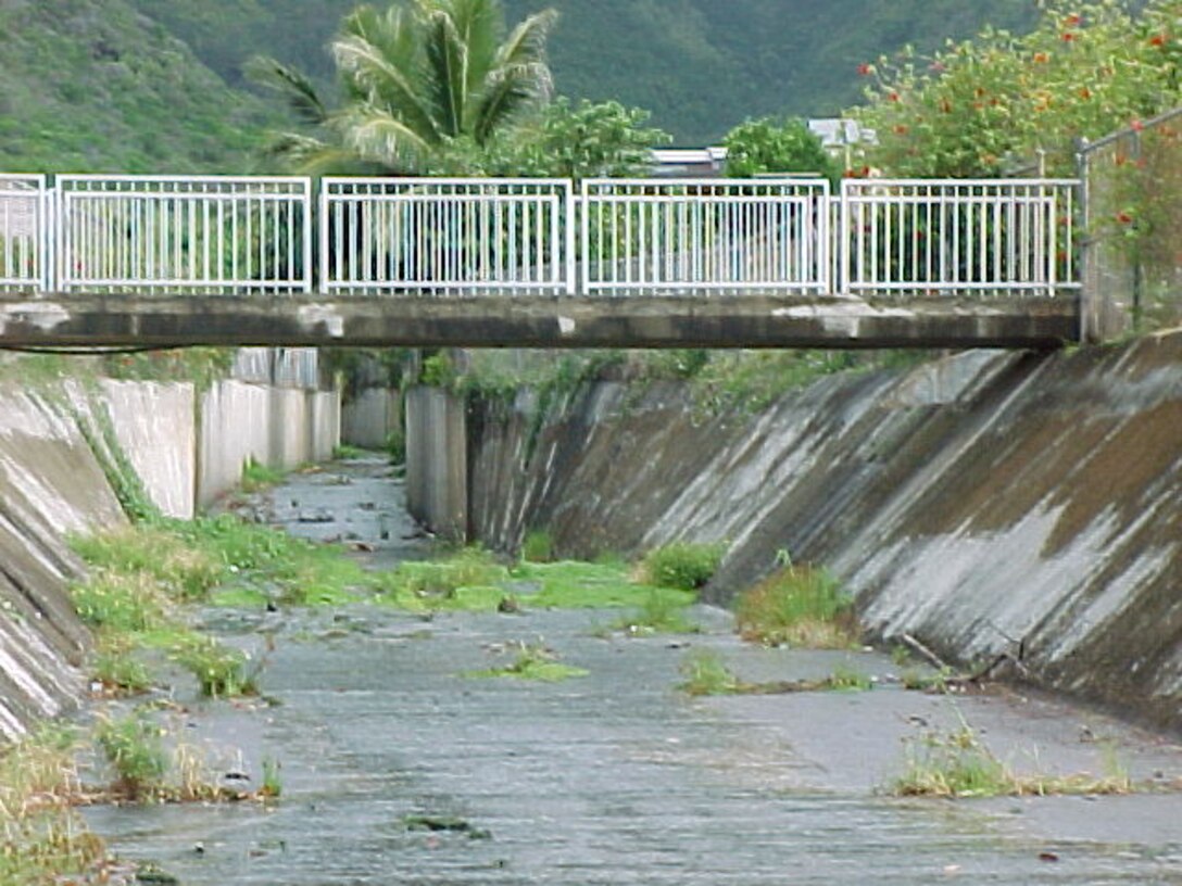 Photograph looking upstream at the completed Kuliouou Stream flood control project. 