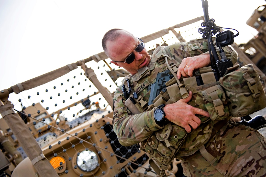 U.S. Air Force Master Sgt. Frederick Sobotka adjusts his body armor before a mission outside the wire in Jalalabad City, Nangarhar province, Afghanistan, March 18, 2012. Sobotka is assigned to the Nagarhar Agribusiness Development Team.