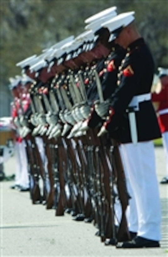 U.S. Marines with the Silent Drill Platoon attach bayonets to their M1 Garand rifles during a performance at Parris Island, S.C., on March 12, 2012.  
