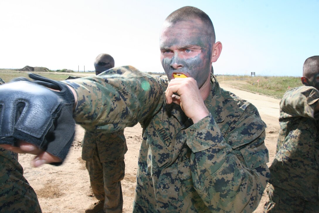 Recruit Tyler Jones, Platoon 2142, Company G, 2nd Recruit Training Battalion, executes the rear hand punch at the body sparring event at Weapons and Field Training Battalion, Marine Corps Base Camp Pendleton March 20. The recruits are participating in a 54-hour field training exericise known as The Crucible, which requires recruits to undergo food and sleep depravation to simulate combat situations.