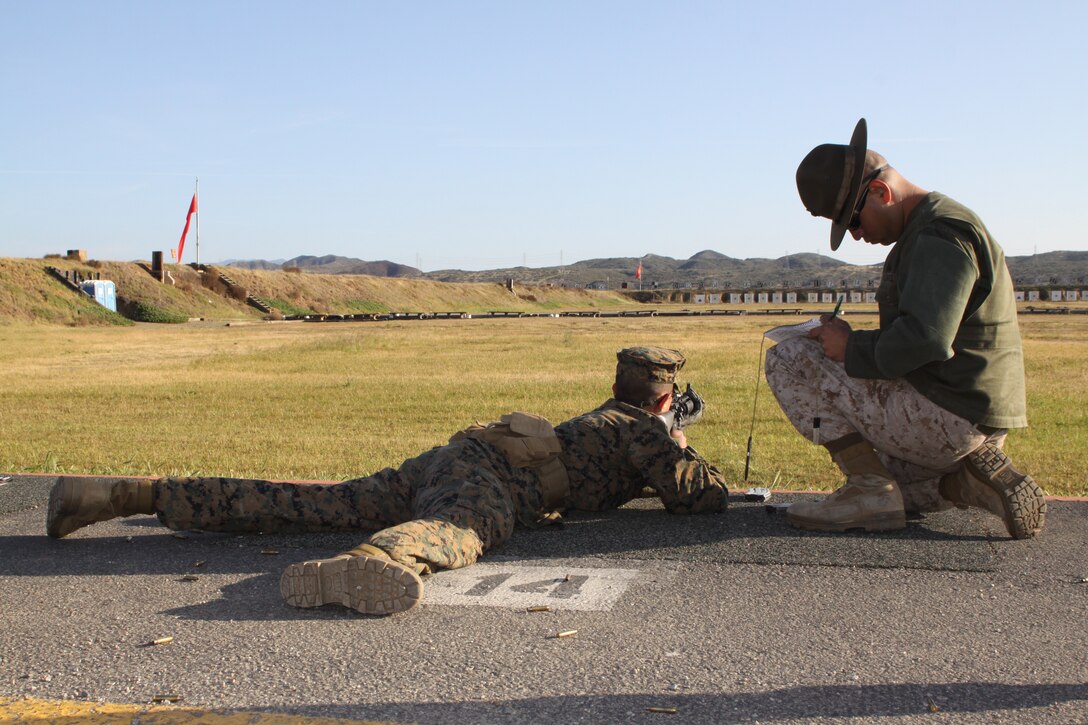 Recruit Cristos Diaz, Platoon 3254, Company L, 3rd Recruit Training Battalion, shoots his M-16 A4 service rifle on Delta Range, Edson Range, Weapons and Field Training Battalion, Marine Corps Base Camp Pendleton March 20. Campbell was guided on shooting techniques by Cpl. Edgar Alvarez, primary marksmanship instructors,Edson Range, Weapons and Field Training Battalion, Marine Corps Base Camp Pendleton to help enfore the fundamentals of Marine Corps marksmanship. PMI's ensured Co. L recruits understood how to properly us the M-16 A4 service rifle.