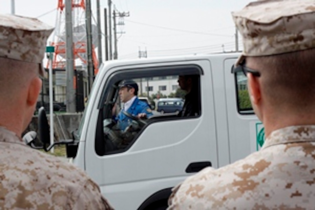 Sergeant Collin J. Walter, or “Rain Man” as he’s called by his fellow communications Marines, a data network specialist with the 31st Marine Expeditionary Unit, troubleshoots a government computer here, March 21. Walter is known as the “Rain Man” because of his unique ability to look at a problem and fix the discrepancy. As the 31st MEU continues its patrol of the Asia-Pacific region, Walters’s command is happy knowing that he will continue to use his unique abilities to train Marines.