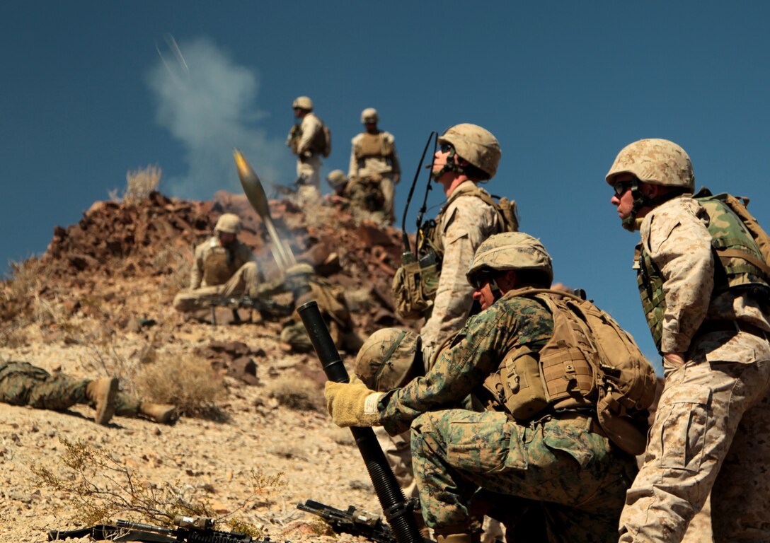2nd Lt. Gregory R. Jaunal, student, Infantry Officers’ Course, fires a mortar round during a mountain attack in the Bullion Training Area March 21, 2012. The mountain attack was part of their four-day culminating exercise from PALM FEX.