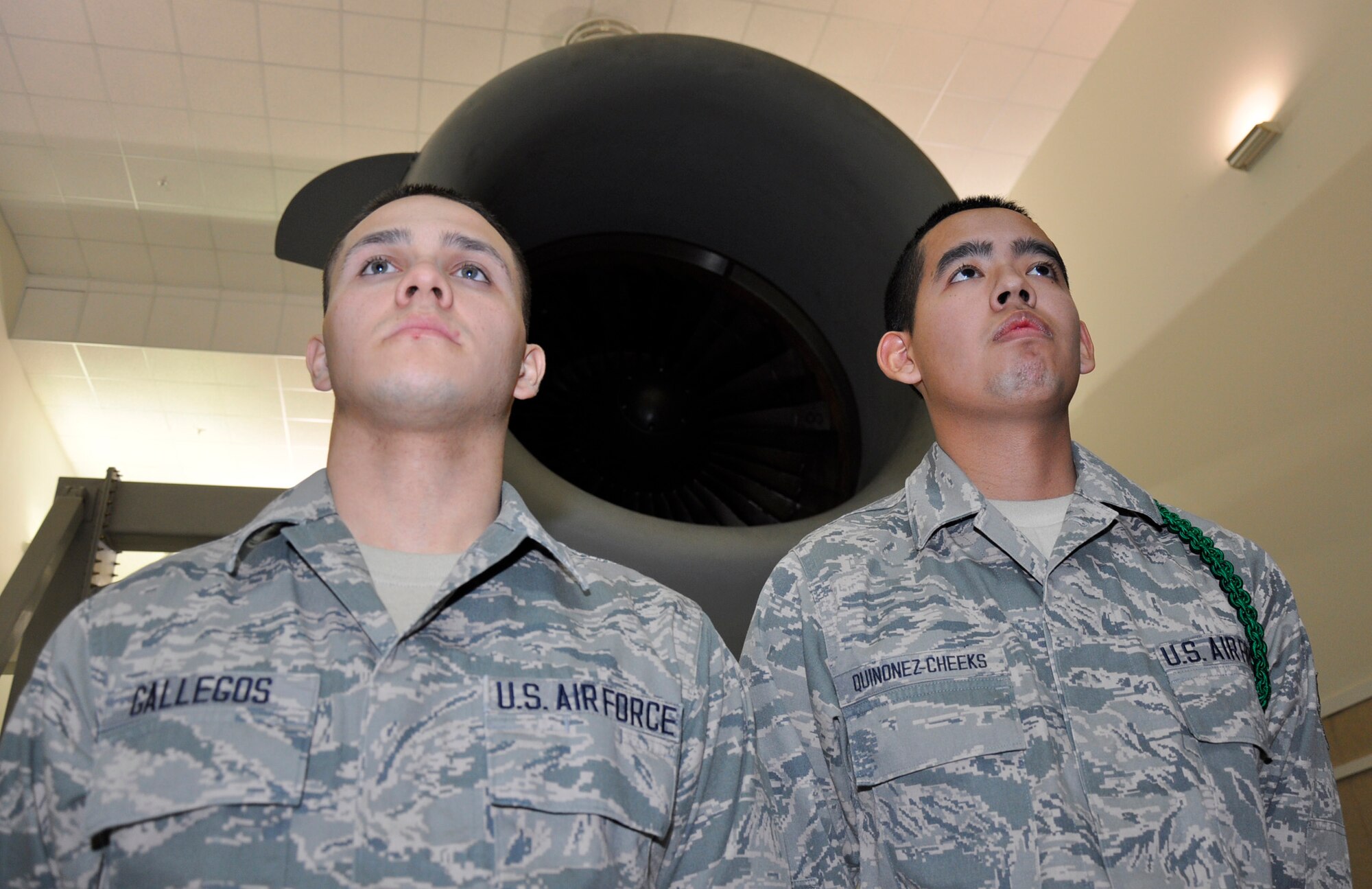 Airman 1st Class Marciano Quinonez-Cheeks (left) and Airman Basic Michael Gallegos, both assigned to the 446th Aircraft Maintenance Squadron out of McChord Field, Wash., after graduating from the 373rd Field Training Detachment here, March 21, 2012. Both graduates will be crew chiefs with the 446th AMXS. Quinonez-Cheeks, 18, joined the Reserve because he wanted to serve. He chose a career as a crew chief because it's related to his goal of majoring in aerospace engineering. The Federal Way resident plans on attending Highline Community College in Des Moines in the fall. Gallegos, 22, has always loved rolling up his sleeves and getting his hands dirty working on automobiles. He joined the Reserve, so he could upgrade to working on C-17 Globemaster III aircraft. The husband, and father of one, lives in Ogden, Utah and plans on moving his family to the Seattle area in the near future. (U.S. Air Force photo/Master Sgt. Jake Chappelle/Released)