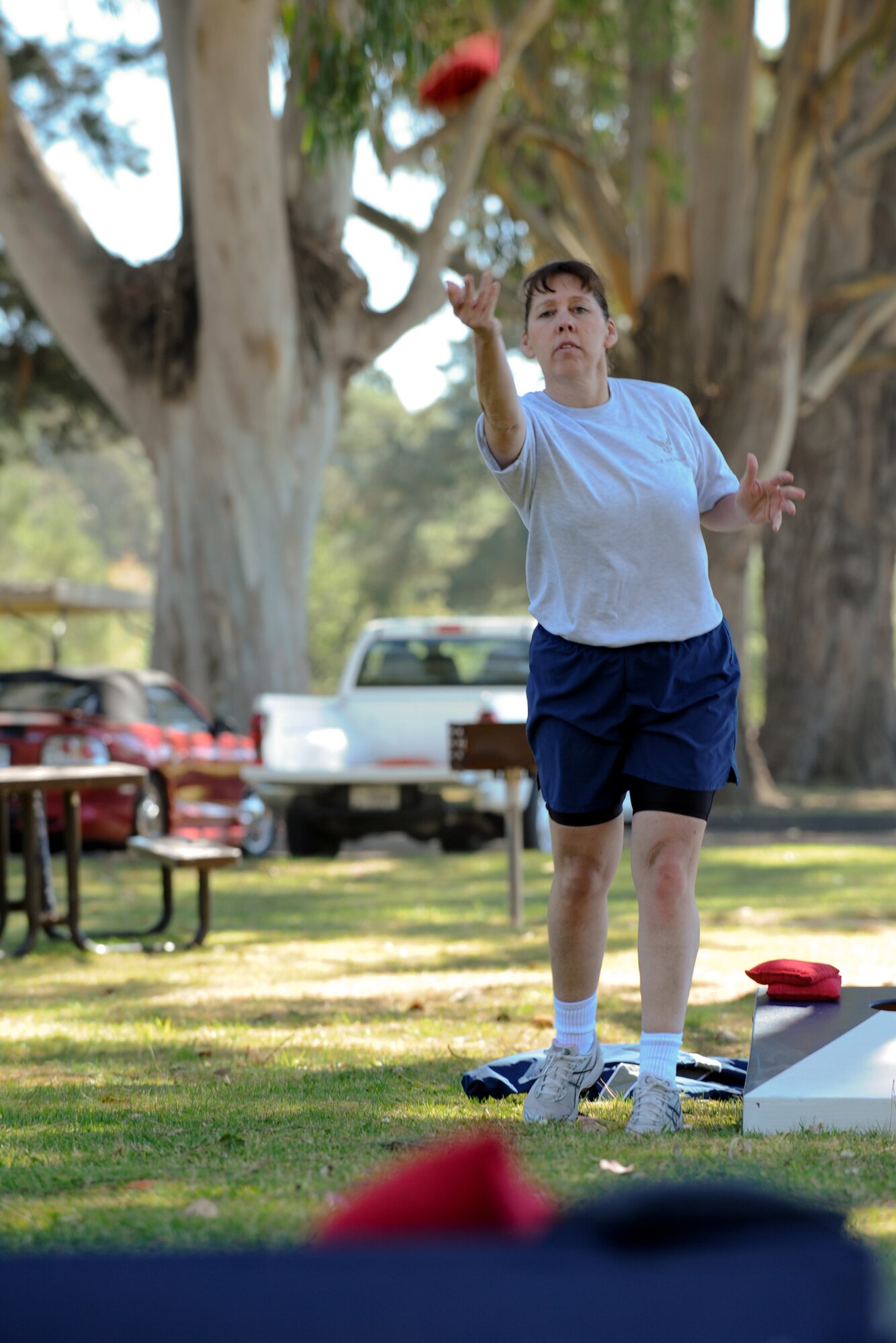 VANDENBERG AIR FORCE BASE, Calif. -- Chief Master Sgt. Suzanne Talbert, 30th Space Wing command chief, plays a pick-up game of cornhole during the Air Force Assistance Fund kick-off barbeque at Cocheo Park here Tuesday, March 20, 2012. According to the AFAF website, the fund was established as an annual fundraiser for the charities that directly support Air Force people. (U.S. Air Force photo/Staff Sgt. Levi Riendeau)