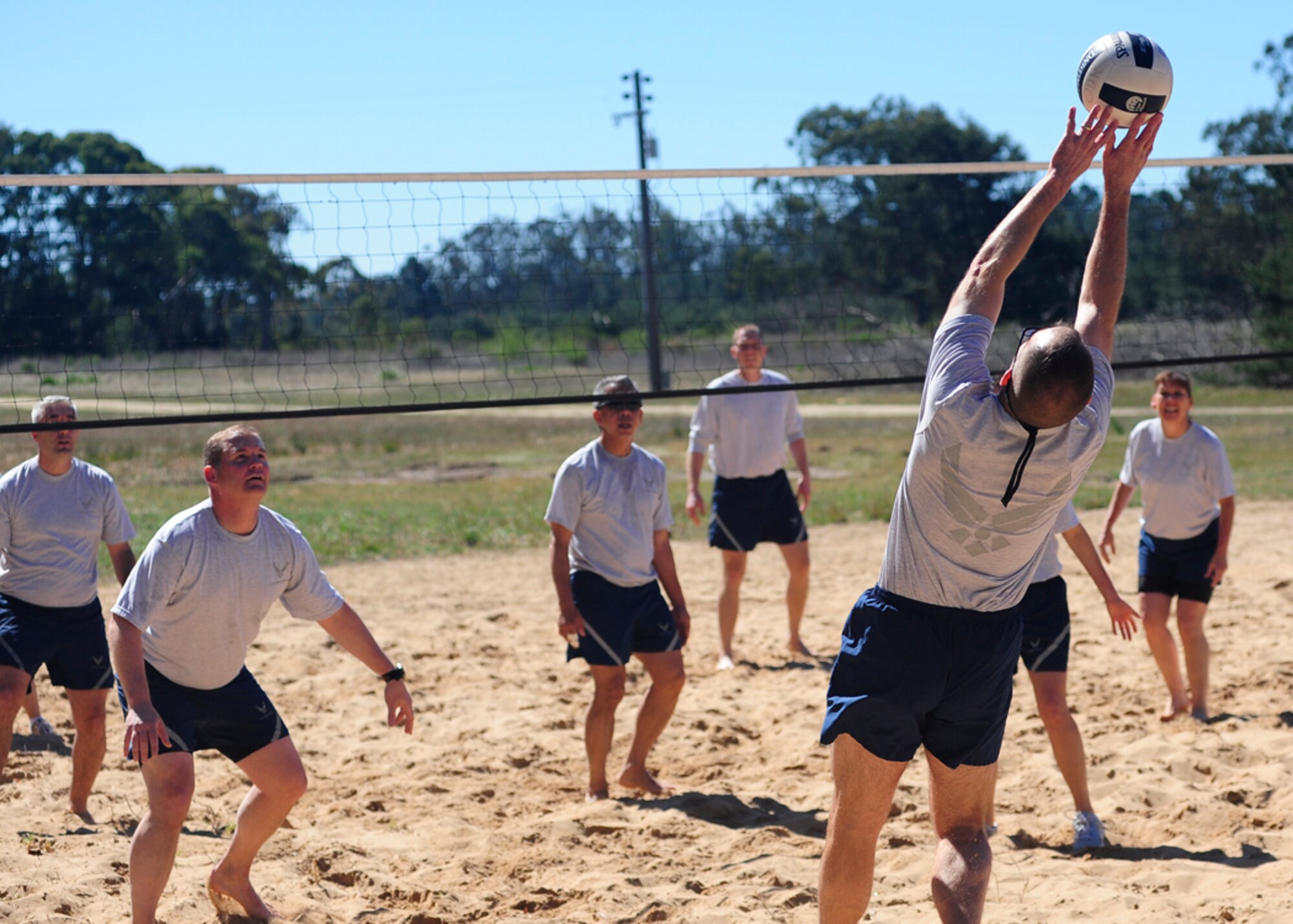 VANDENBERG AIR FORCE BASE, Calif. -- Airmen face-off during the "Eagles vs. Chiefs" volleyball game at the Air Force Assistance Fund kick-off barbeque here Tuesday, March 20, 2012. An "Eagles vs. Chiefs" game typically pits a team of Vandenberg commanders against a team of Vandenberg command chiefs. The Chiefs won both matches by a score of 15 to 11. (U.S. Air Force photo/Michael Peterson)