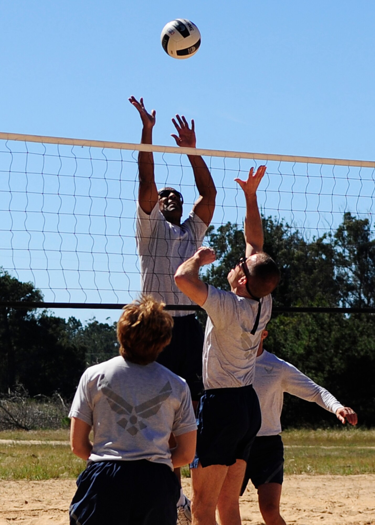 VANDENBERG AIR FORCE BASE, Calif. -- Airmen face-off during the "Eagles vs. Chiefs" volleyball game at the Air Force Assistance Fund kick-off barbeque here Tuesday, March 20, 2012. An "Eagles vs. Chiefs" game typically pits a team of Vandenberg commanders against a team of Vandenberg command chiefs. The Chiefs won both matches by a score of 15 to 11. (U.S. Air Force photo/Michael Peterson)
