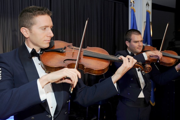 Master Sgt. Bryce Bunner and Master Sgt. William Hurd perform.  Sgt. Bunner will perform with a string quartet at a Chamber Players Series concert at Burke United Methodist Church in Burke, Va. on May 4, 2012.  (U.S. Air Force photo by Tech. Sgt. Raymond Mills)