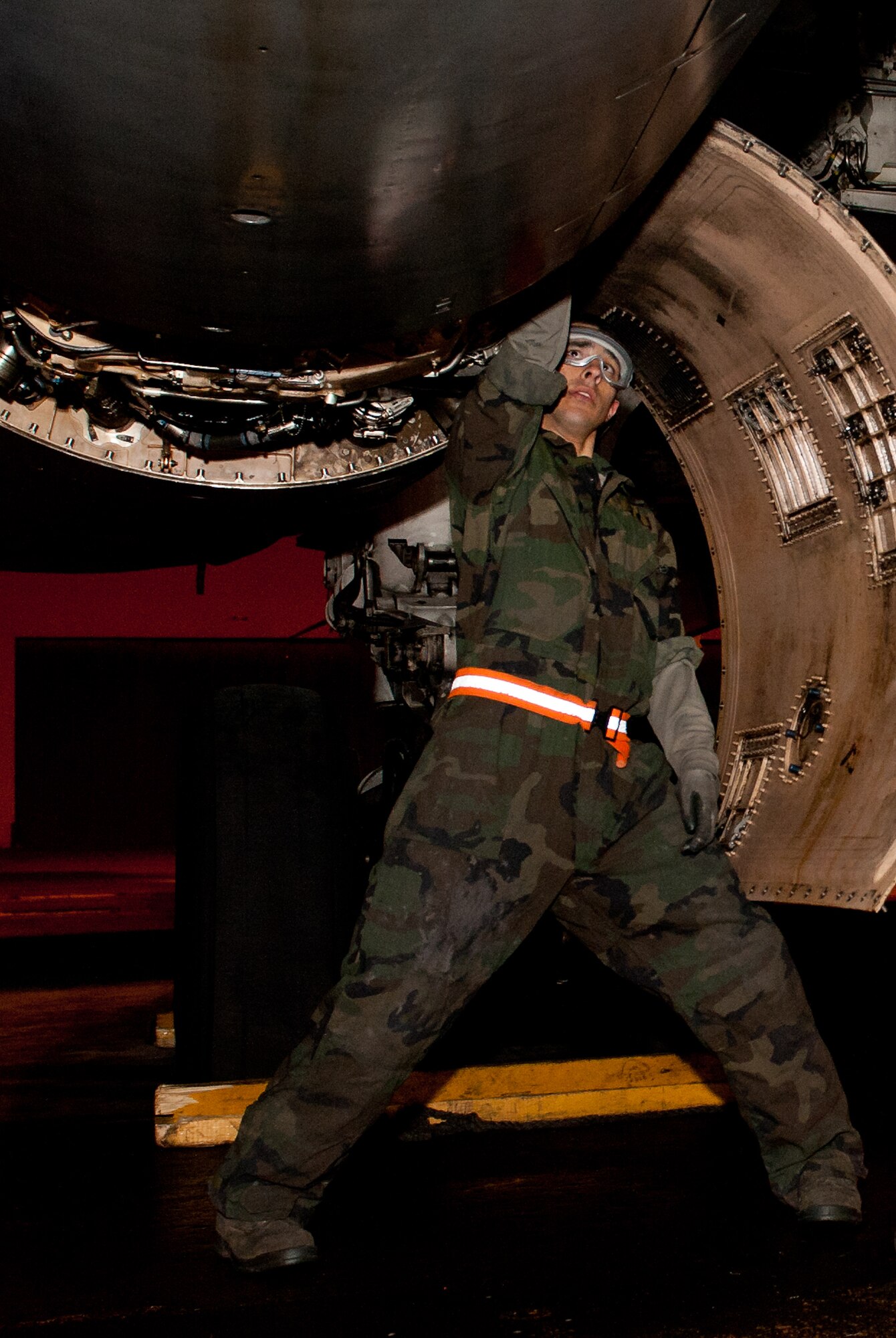 Senior Airman Spencer Hesinger, 28th Maintenance Squadron sheet metal journeyman, replaces jo-bolts on a B-1 bomber during an Operational Readiness Exercise at Ellsworth Air Force Base, S.D., March 15, 2012. The bolts keep the aircraft skin fastened to the frame. (U.S. Air Force photo by Airman 1st Class Kate Thornton/Released)