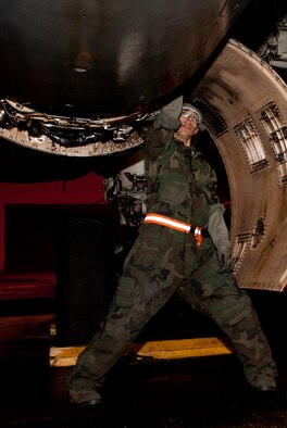 Senior Airman Spencer Hesinger, 28th Maintenance Squadron sheet metal journeyman, replaces jo-bolts on a B-1 bomber during an Operational Readiness Exercise at Ellsworth Air Force Base, S.D., March 15, 2012. The bolts keep the aircraft skin fastened to the frame. (U.S. Air Force photo by Airman 1st Class Kate Thornton/Released)