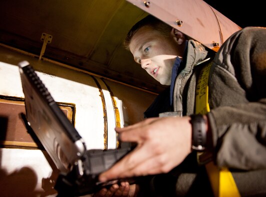 Senior Airman Preston Block, 28th Aircraft Maintenance Squadron crew chief, reads a technical order during maintenance on a B-1 bomber radome during an Operational Readiness Exercise at Ellsworth Air Force Base, S.D., March 15, 2012. It’s mandatory that Airmen follow each step of their TO to ensure maintenance is performed correctly and efficiently. (U.S. Air Force photo by Airman 1st Class Kate Thornton/Released)