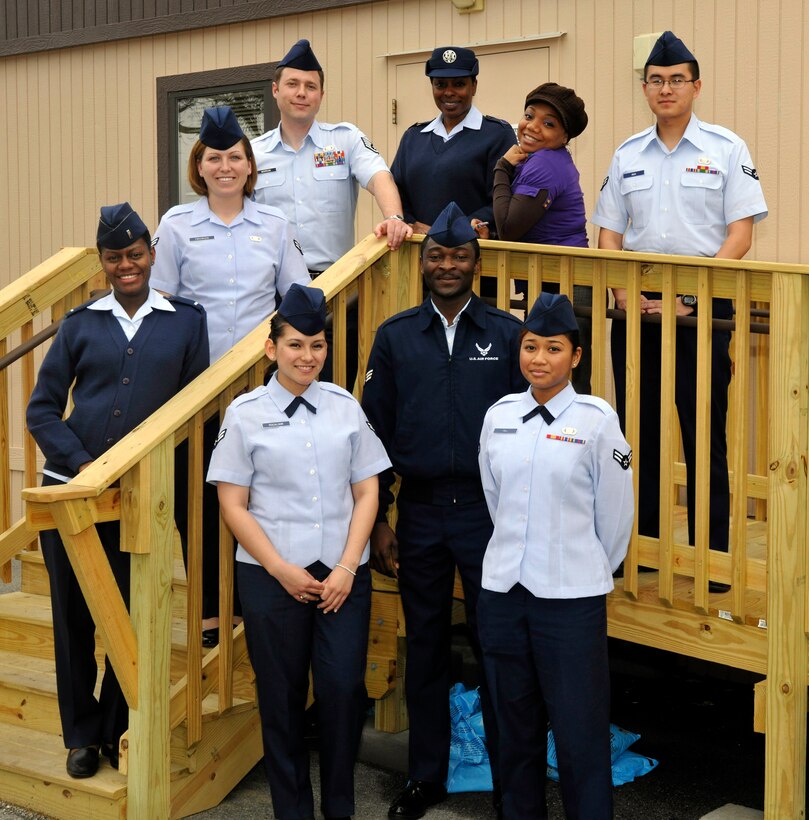 11th Comptroller Squadron finance technicians and customer service representatives pose for a photo outside the 11 CPTS office trailer March 21. 11 CPTS personnel are responsible for maintaining the financial readiness for more than 65,000 service members throughout the National Capital Region. (U.S. Air Force photo/Airman 1st Class Lindsey A. Beadle)