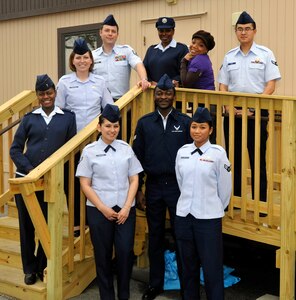 11th Comptroller Squadron finance technicians and customer service representatives pose for a photo outside the 11 CPTS office trailer March 21. 11 CPTS personnel are responsible for maintaining the financial readiness for more than 65,000 service members throughout the National Capital Region. (U.S. Air Force photo/Airman 1st Class Lindsey A. Beadle)