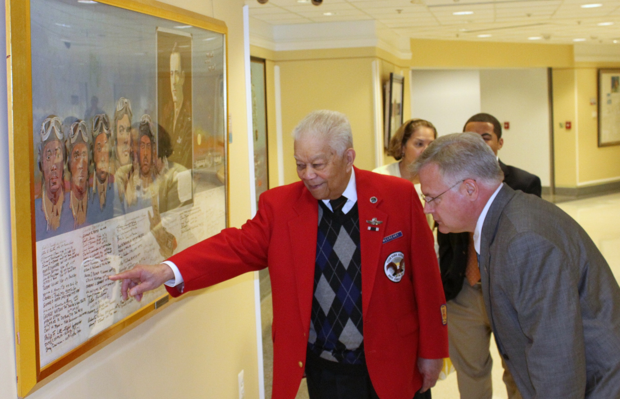 Retired Lt. Col. Walter McCreary points out the name of a fellow Tuskegee Airman to Russell Kirk, the director of the Air Force Art Gallery, during a visit to the Pentagon on March 16, 2012. McCreary, a member of the Tuskegee Airmen, conducted 89 combat missions during World War II. (U.S. Air Force photo/Lou Timmons)