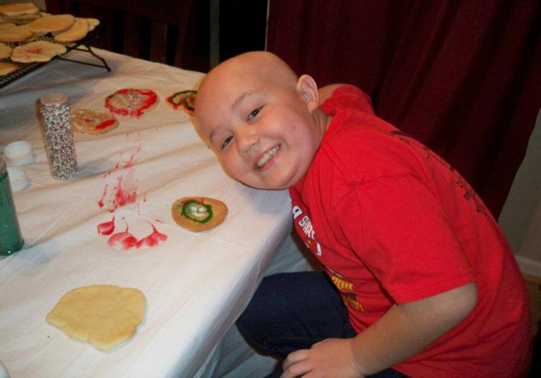 Ayden Egan, son of Tech. Sgt. Richard Egan, F-15 Mission Ready Airmen instructor with the 372d Training Squadron, Det 1, Seymour-Johnson AFB, N.C.,makes cookies at the family home.  Ayden suffers from Acute Lymphoblastic Leukemia and detachments from the 982d Training Group headquartered at Sheppard AFB, Texas, have raised over $5,000 to help the Egan family. (U.S. Air Force photo/courtesy of Egan family)