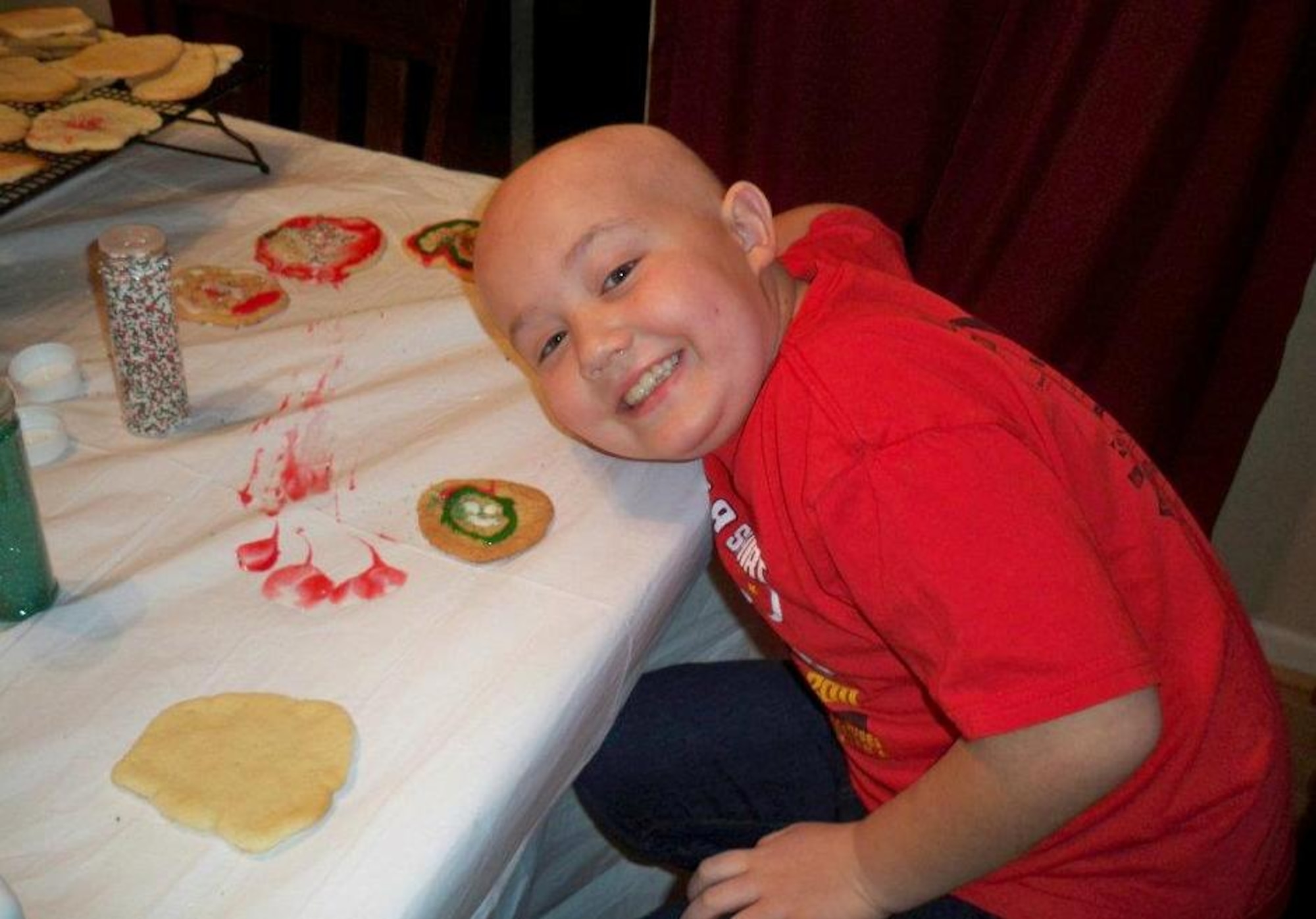 Ayden Egan, son of Tech. Sgt. Richard Egan, F-15 Mission Ready Airmen instructor with the 372d Training Squadron, Det 1, Seymour-Johnson AFB, N.C.,makes cookies at the family home.  Ayden suffers from Acute Lymphoblastic Leukemia and detachments from the 982d Training Group headquartered at Sheppard AFB, Texas, have raised over $5,000 to help the Egan family. (U.S. Air Force photo/courtesy of Egan family)