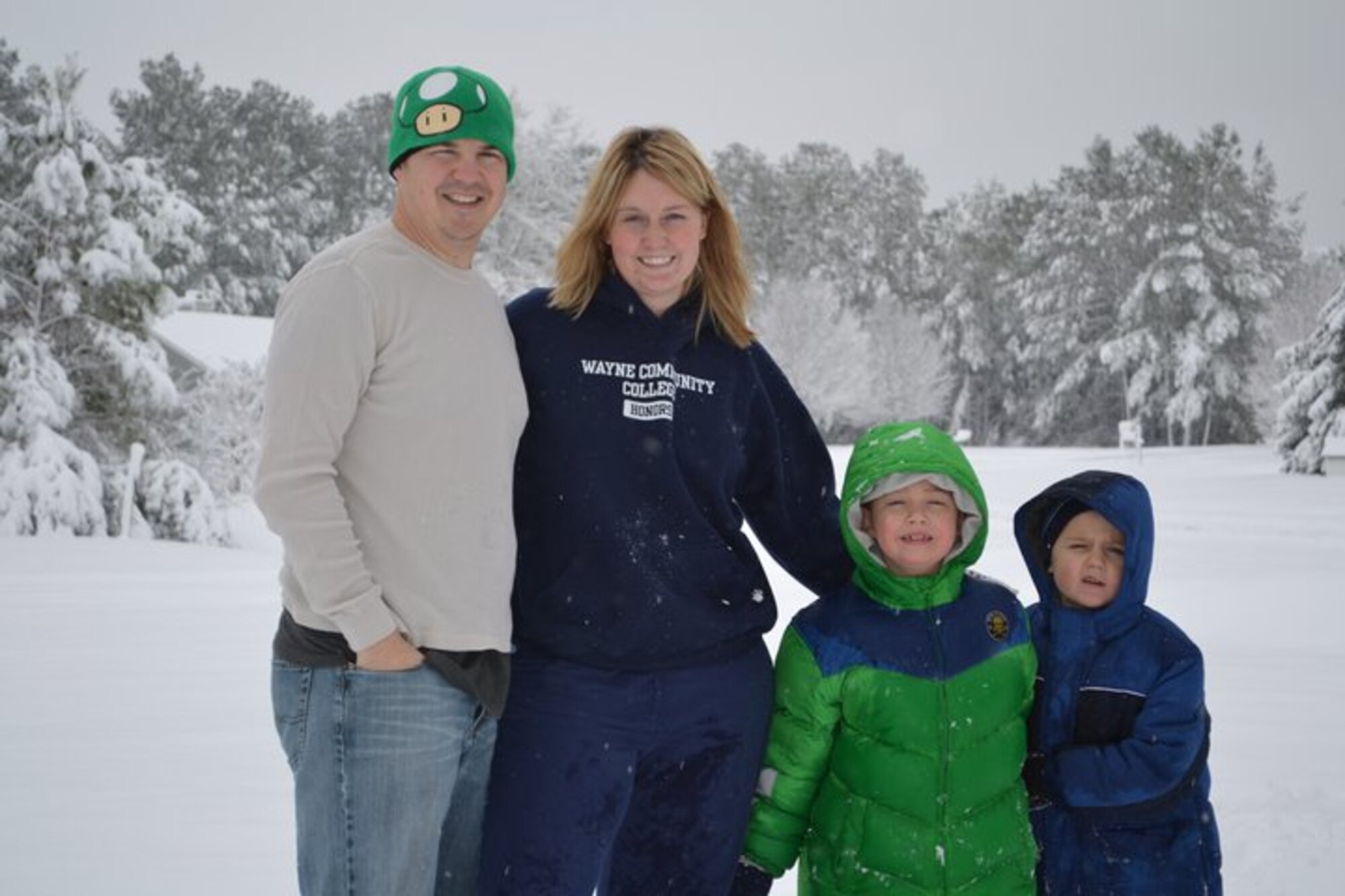Tech. Sgt. Richard Egan, F-15 Mission Ready Airmen instructor with the 372d Training Squadron, Det 1, Seymour-Johnson AFB, N.C., stands with wife Holly and sons Ayden (left) and Dylan (right).  Ayden suffers from Acute Lymphoblastic Leukemia and detachments from the 982d Training Group headquartered at Sheppard AFB, Texas, have raised over $5,000 to help the Egan family. (U.S. Air Force photo/courtesy of Egan family)