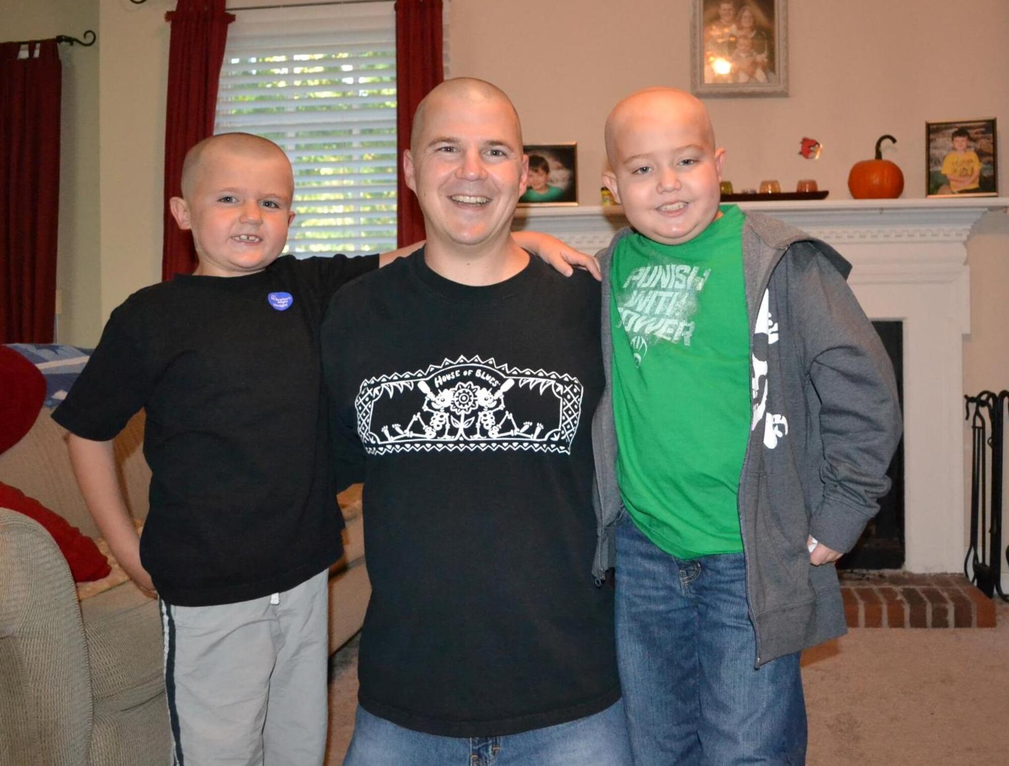 Tech. Sgt. Richard Egan, F-15 Mission Ready Airmen instructor with the 372d Training Squadron, Det 1, Seymour-Johnson AFB, N.C., poses with sons Ayden (right) and Dylan (left).  Ayden suffers from Acute Lymphoblastic Leukemia and detachments from the 982d Training Group headquartered at Sheppard AFB, Texas, have raised over $5,000 to help the Egan family. (U.S. Air Force photo/courtesy of Egan family)