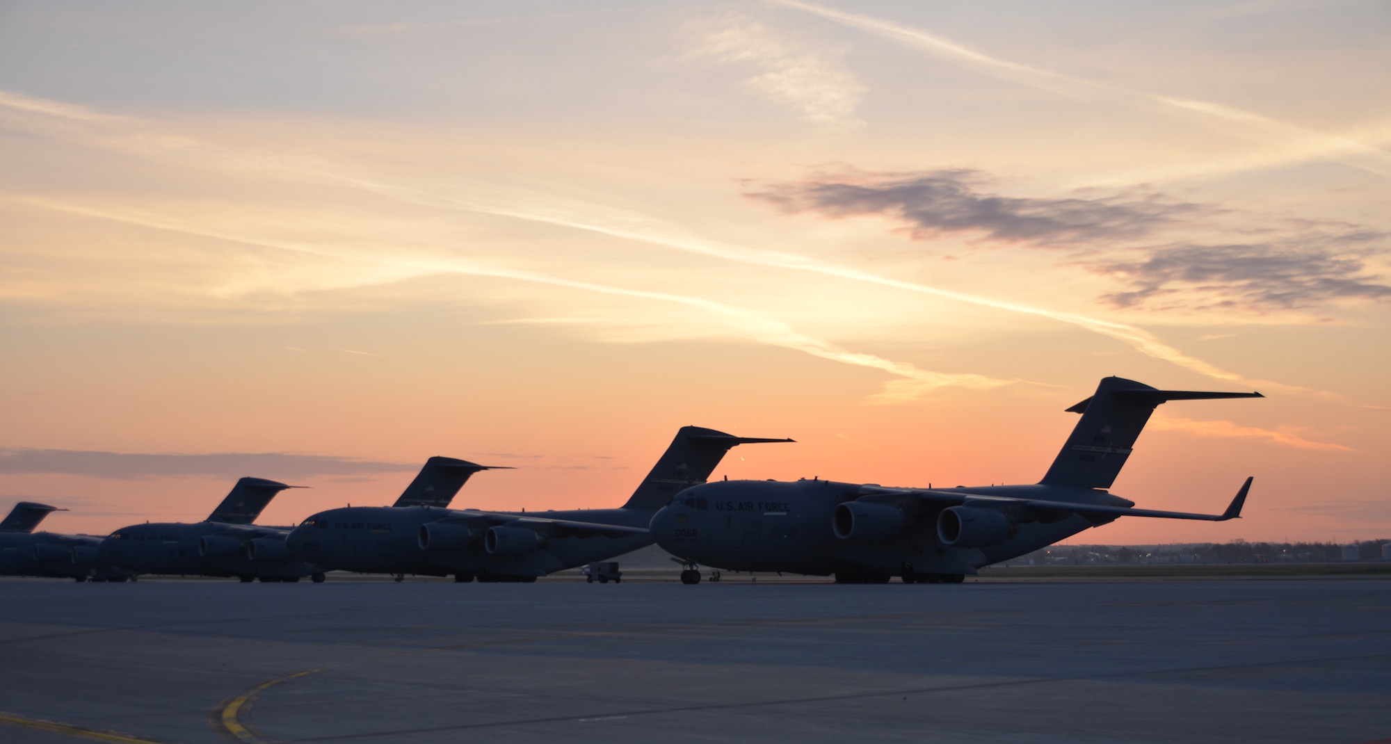 WRIGHT-PATTERSON AIR FORCE BASE, Ohio –The early morning sunrise provides the perfect backdrop, highlighting the beauty of the 445th Airlift Wing C-17 Globemaster III aircraft sitting on the flightline at Wright-Patterson Air Force Base, Ohio, March 21. (U.S. Air Force photo/Stacy Vaughn)