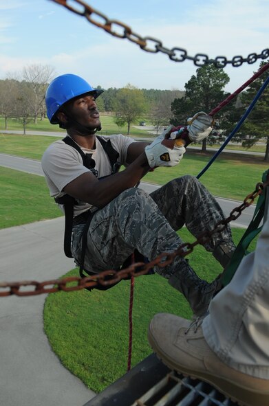 U.S. Air Force Senior Airman Cartalo Madison rappels off the burn tower during a Department of Defense Rescue Technician Course on Seymour Johnson Air Force Base, N.C., March 20, 2012. Airmen must learn patience and strategic thinking in order to avoid injuries while repelling. Madison, 4th Civil Engineer Squadron Fire Protection Flight, hails from Chesapeake, Va. (U.S. Air Force photo/Airman 1st Class Aubrey Robinson/Released)