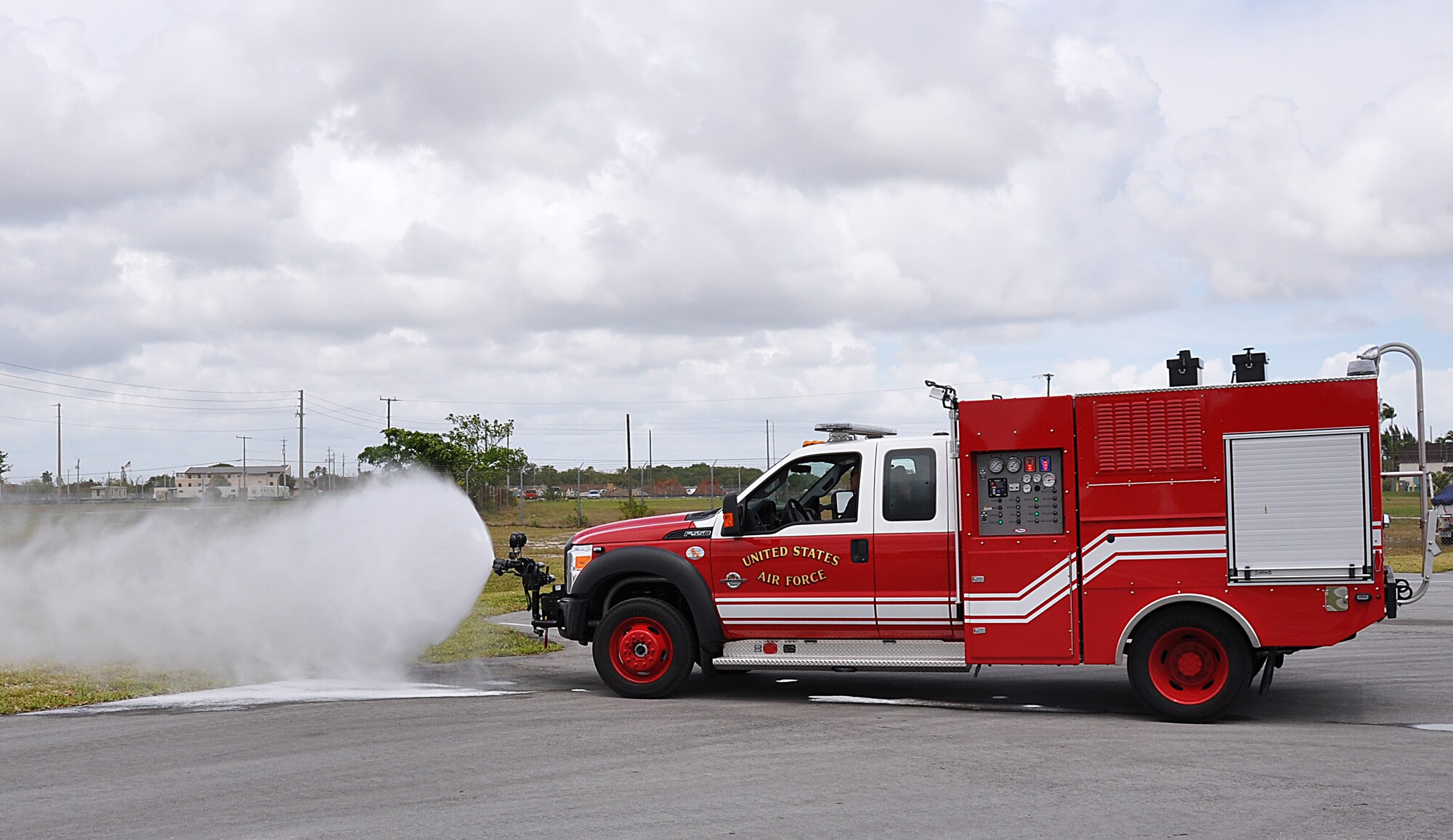 Homestead Air Reserve Base Fire Department's firefighters train in the department's new P-34 rapid intervention vehicle, on Mar. 20. Fire fighter trained and familiarized themselves  in all the vehicle systems, maneuverability and operating  components and using the Ultra High Pressure technology. (U. S. Air Force Photo by Senior Airman Jacob Jimenez, 482nd Fighter Wing Public Affairs.)