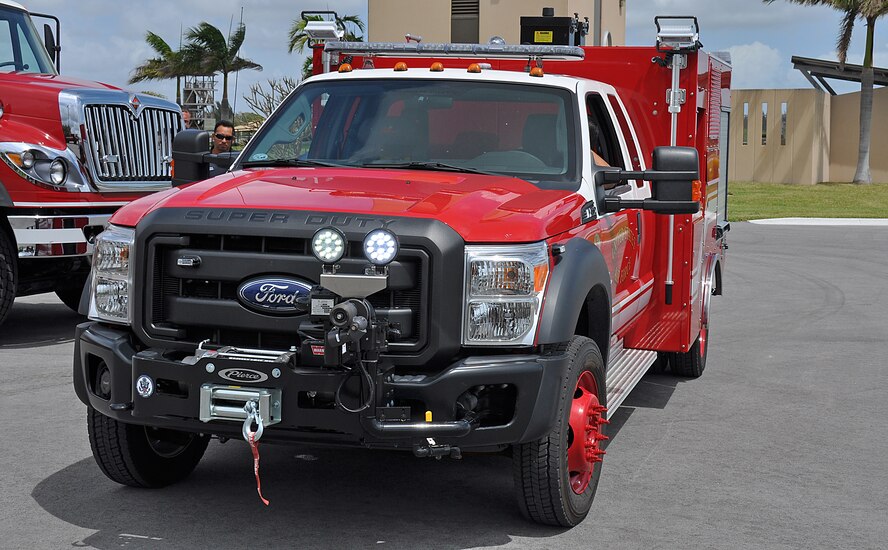 Homestead Air Reserve Base Fire Department's firefighters idle in the department's new P-34 rapid intervention vehicle to begin training on its systems, on Mar. 20. The new truck implements Ultra High Pressure technology that exceeds the limitations of the traditional low pressure fire fighting systems. (U. S. Air Force Photo by Senior Airman Jacob Jimenez, 482nd Fighter Wing Public Affairs.)