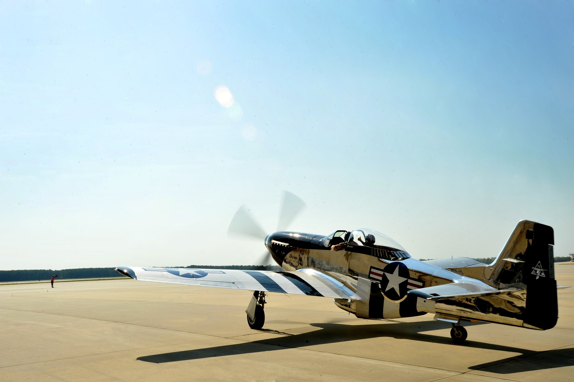 A P-51 Mustang prepares to takeoff from the Shaw flightline, March 19, 2012, Shaw Air Force Base, S.C. The P-51 Mustang "Quick Silver" was restored more than 13 years ago by father and son Bill and Scott Yoak. Yoak's P-51 Mustang will be one of the many aircraft that will perform during the upcoming Shaw Air Expo, May 5-6. (U.S. Air Force photo by Senior Airman Kenny Holston/Released)
